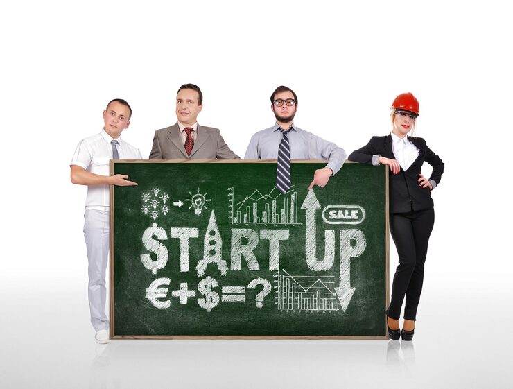 businesspeople-holding-blackboard-with-start-up_253658-11949